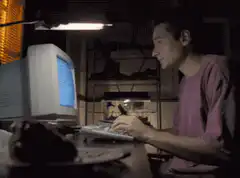 David Duchovny typing and eating