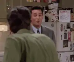Chandler Bing laughs and facepalms