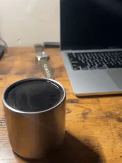 steaming coffee cup on desk