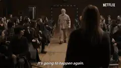 Old man walks down aisle in theater