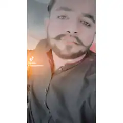 Man with mustache and beard looking at camera