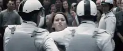 Katniss Everdeen pushed by Peacekeepers