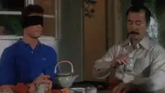 Mr. Burns touches blindfolded man's face