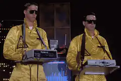 Yazoo performing in yellow suits