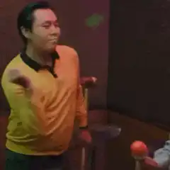 Man in yellow sweater dancing
