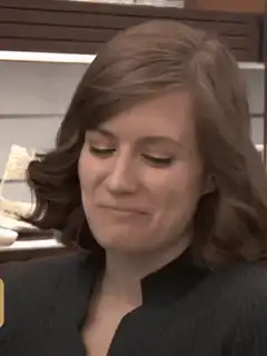 Mindy Kaling smirking and nodding