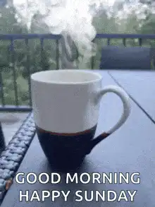 Steaming coffee cup on balcony