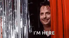 Man peeks from behind curtain saying I'm here