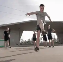 Guy doing a high kick in slow motion