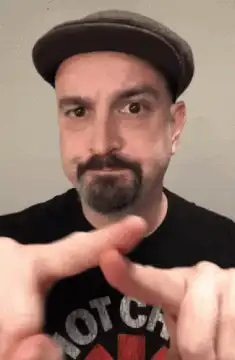 Man wiggling fingers at camera