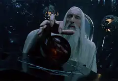 Saruman looking into a palantir