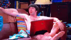 Howard Wolowitz celebrates on the couch