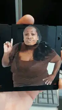 Woman on floppy disk pointing finger