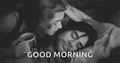 woman kissing sleeping man good morning