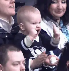 Baby in Penguins jersey cheering
