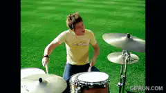 The Lonely Island band playing on a green field
