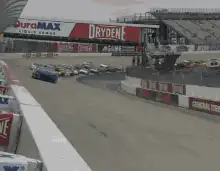 NASCAR race cars speeding past the camera