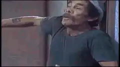 Man in hat laughing hysterically