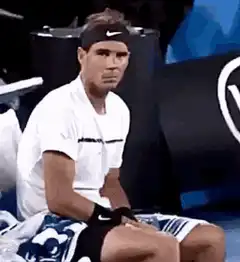 Rafael Nadal sitting and staring