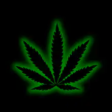 Glowing green marijuana leaf