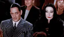 Addams Family members smoking cigars