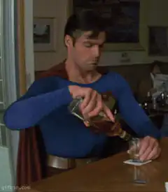 Superman pouring a drink at the bar