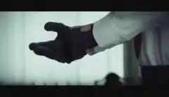 Agent 47 adjusting his suit