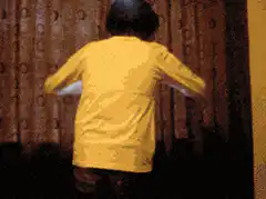 person opening curtains to bright light