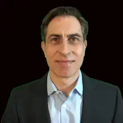 Man in suit smiling slightly