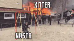Kid on swing in front of burning building