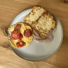plate of eggs tomatoes and toast
