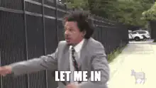 Man yelling let me in at a gate