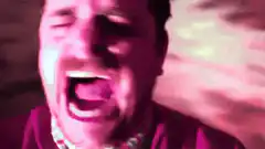 Man screaming in pink light