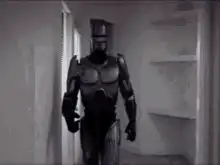 Robocop walks into a room