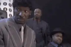 Man in suit laughing hysterically