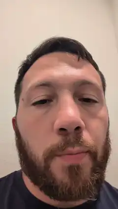 bearded man looking down
