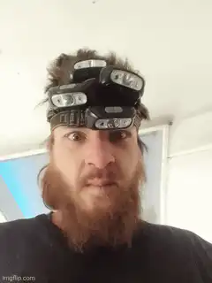 man with headlamp lights turn on