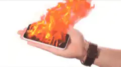 Man holding burning smartphone