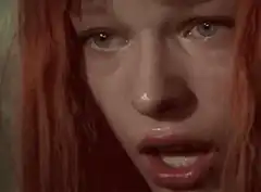 Red-haired girl crying close-up
