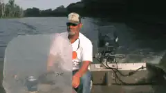 man on boat fish jumps
