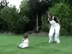 Old lady saluting baby