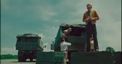 Forrest Gump stands on crates