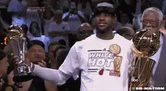 LeBron James holding two trophies