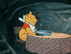 Winnie the Pooh eating honey