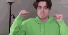 Guy in green hoodie shrugging