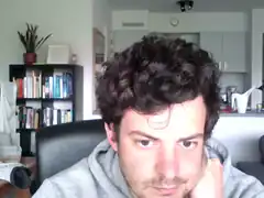 man resting chin on hand