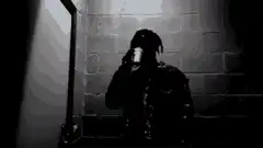 Silhouette man drinking in dark room