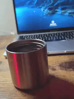 shiny metal cup on desk