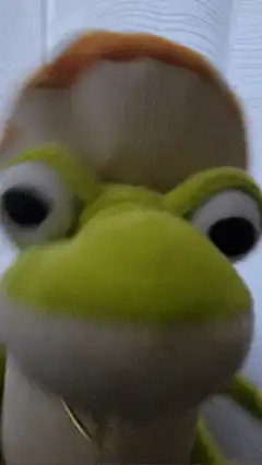 Green frog puppet with mushroom hat