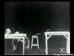 Man levitating heads on table